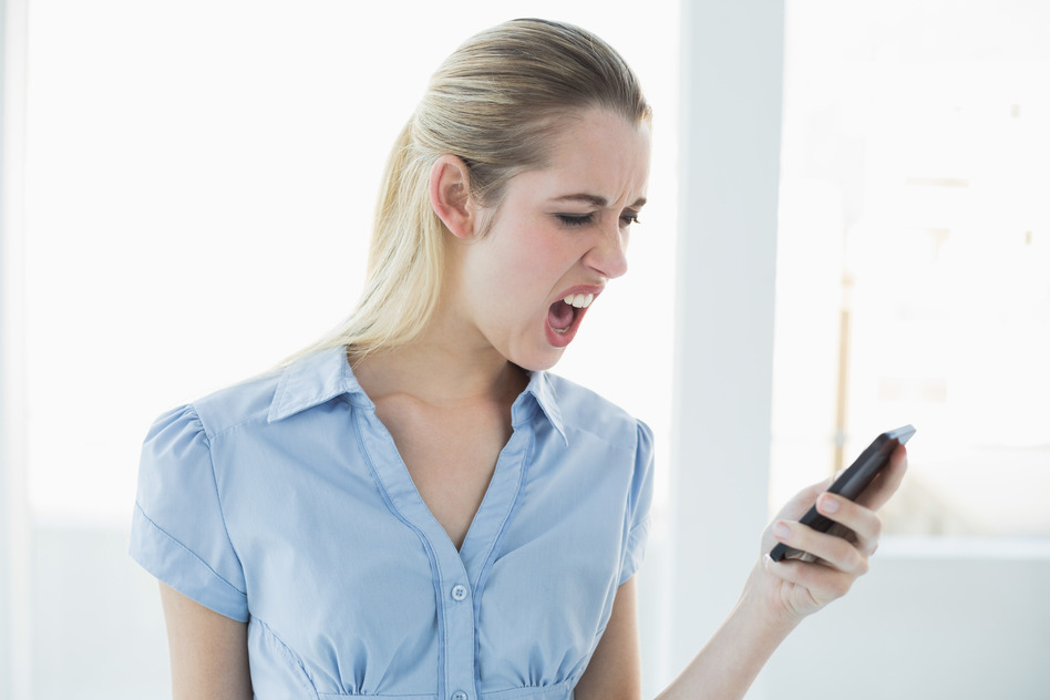 Woman angry at smartphone