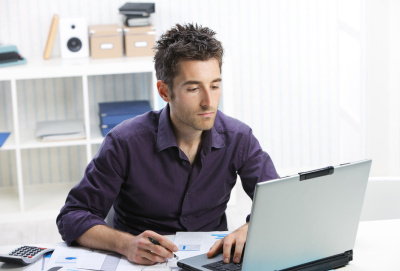 Parent at home on laptop