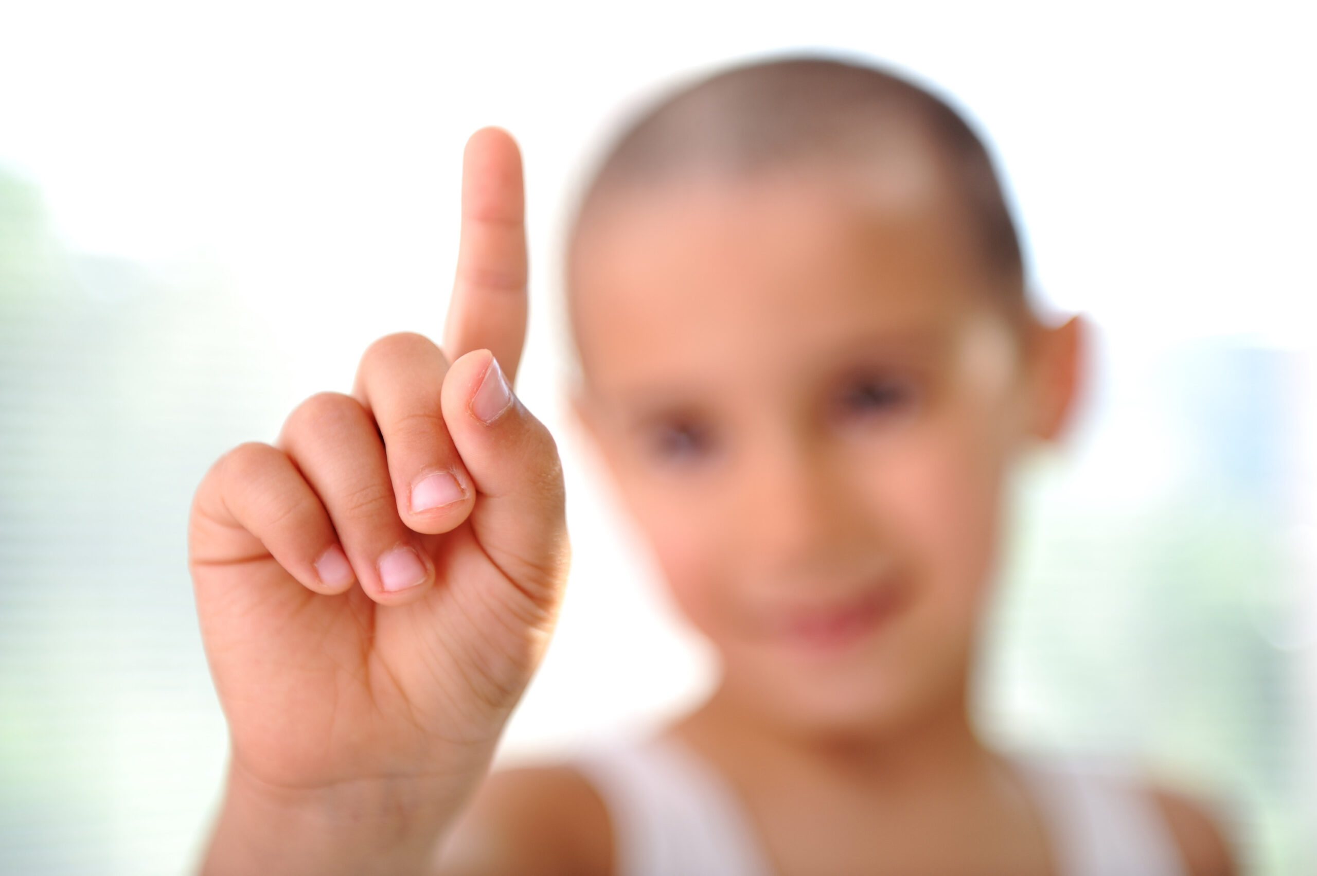 Child touching button